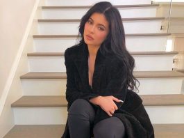 Kylie Jenner sitting on the stairs