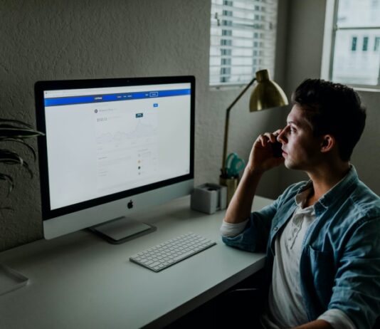 men work on computer