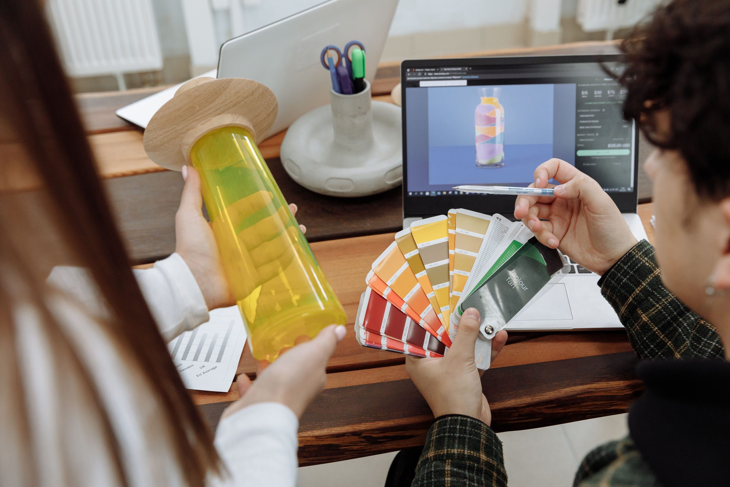 Designers reviewing color swatches and digital mockups during the custom mylar bag concept phase
